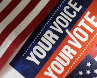 flag with "Your voice your vote" text